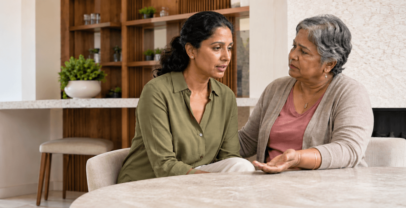 A younger and an older woman talk across the table, reflecting the personal and family conversations that can arise around culture, faith and beliefs.